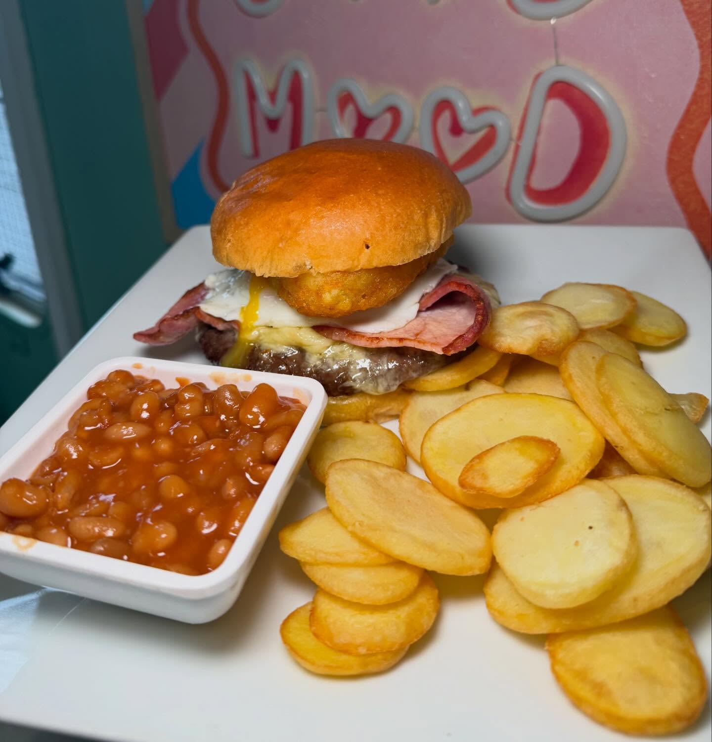 Burger with chips and beans
